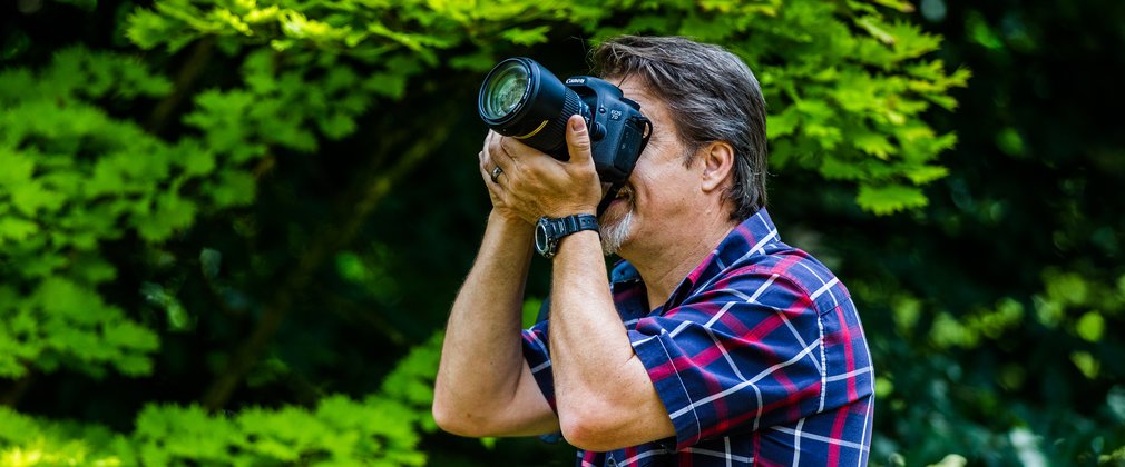 Man taking a photo with camera