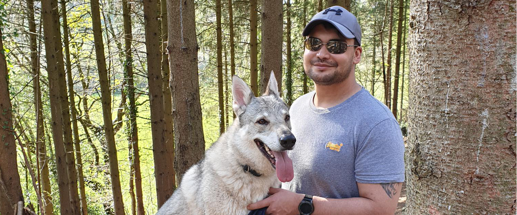 Man with dog in the forest