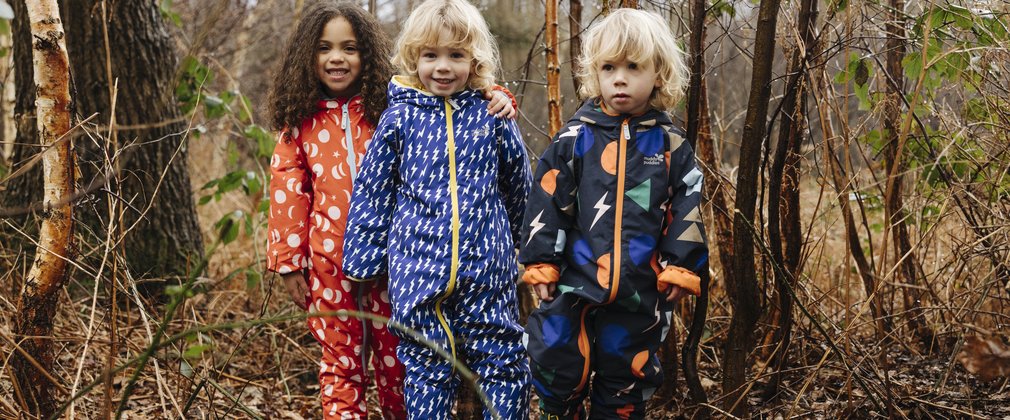 three children in a winter forest
