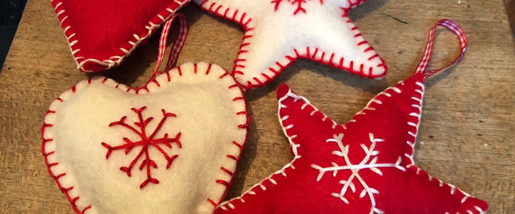 A range of hanging heart and star decorations