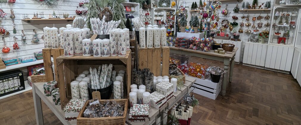 A shop display with lots of Christmas goodies to buy.