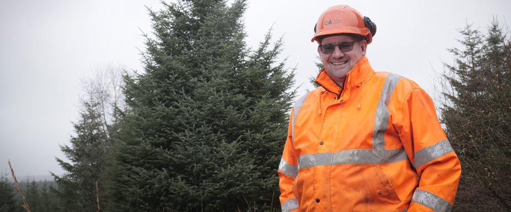 Man with Parliament Christmas Tree 