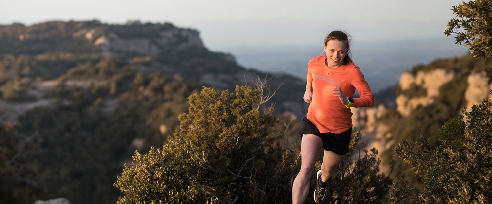 Georgia Tindley running on a trail