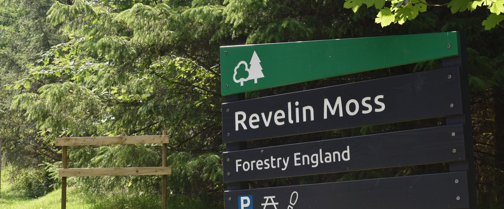 Forest Welcome sign which reads 'Revelin Moss, Forestry England'
