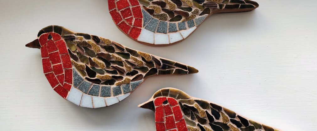 Three decorative mosaic robin bird wall ornaments displayed on a light background.