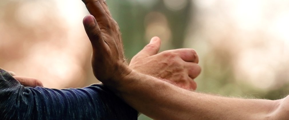 Two hands performing Tai Chi