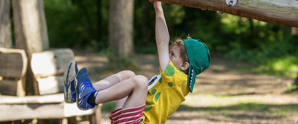 Child playing on Timberline play structure