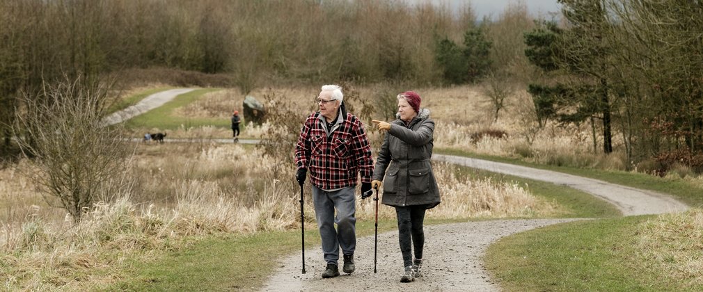 Couple walking at viridor woods in the north west