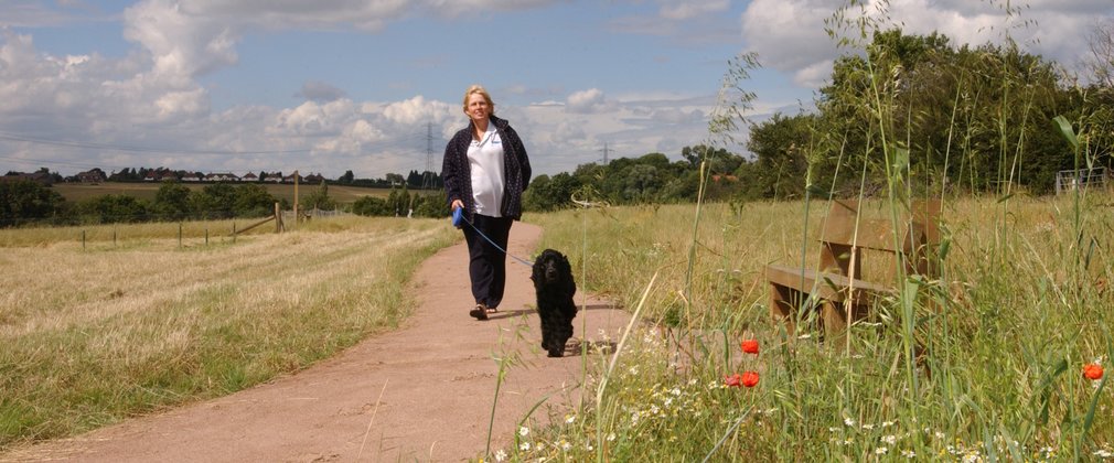 Woman walking dog