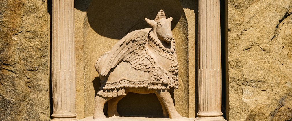 A stone carving of the Winged Sheep by Fiona Bowley