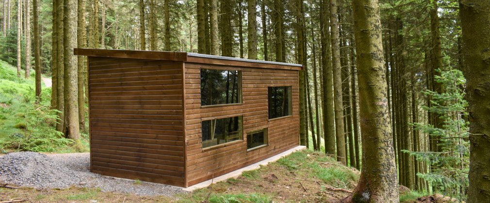 A wildlife hide in a woodland setting