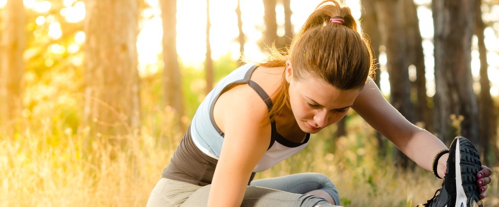 Woman doing yoga in the forest