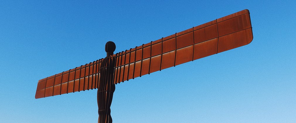 The Angel of the North sculpture with blue skies