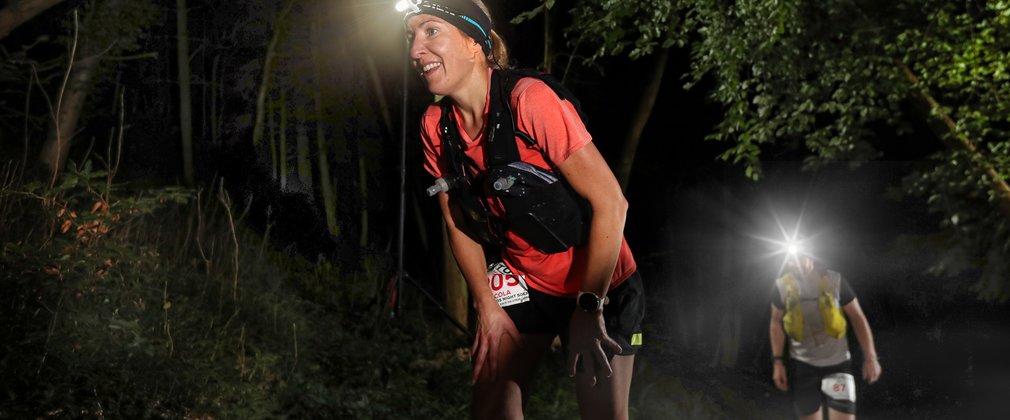 Runner with head torches in Wendover Woods