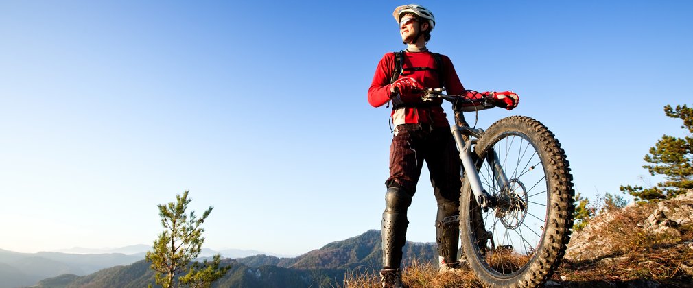 Mountain biker at the top of a forest trail