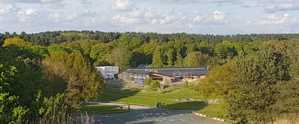 View of visitor centre building in the middle of the forest