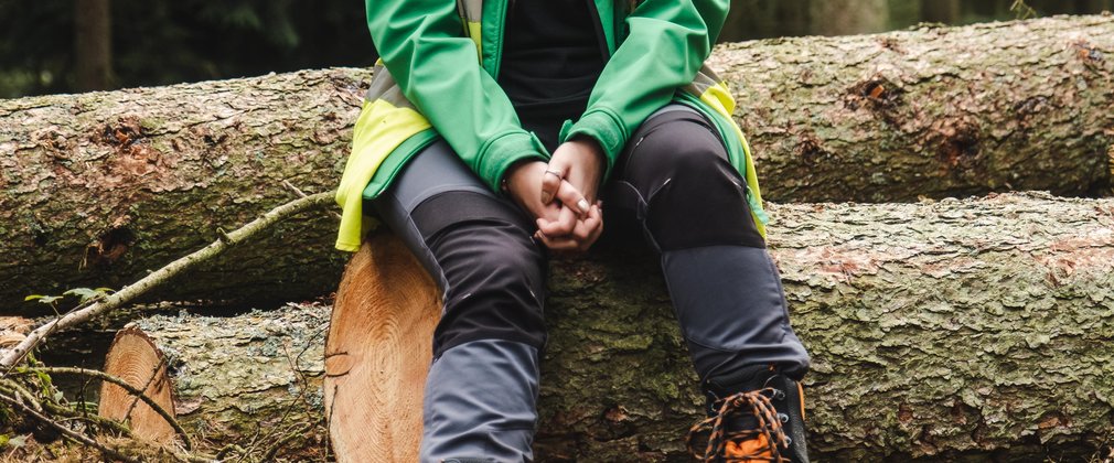 Worker sat on log