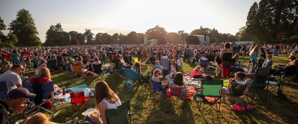 Crowd at sunset at a music concert