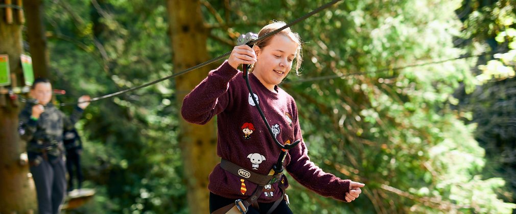 Girl on the Go Ape Treetop Adventure with harness