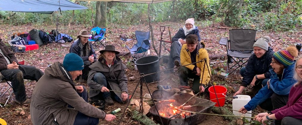 Group of people round a fire 