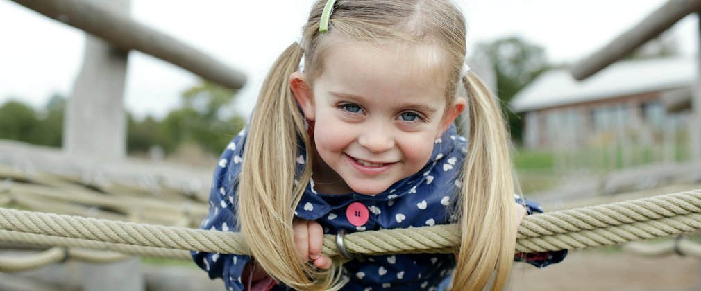 girl on a swing in a playground