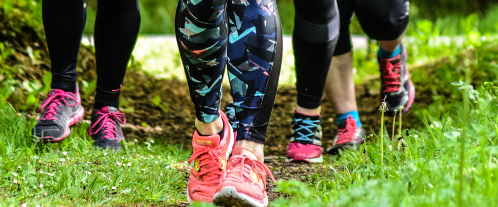 four pairs of legs and feet running