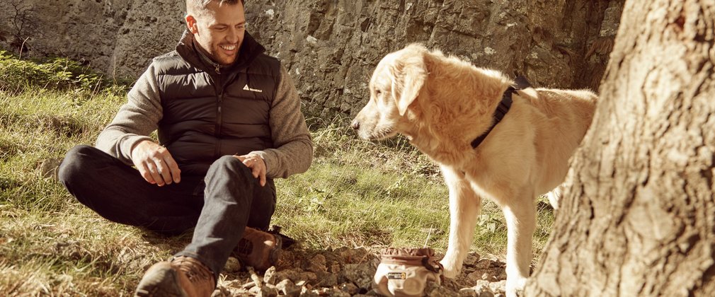 Man sitting on the floor with dog