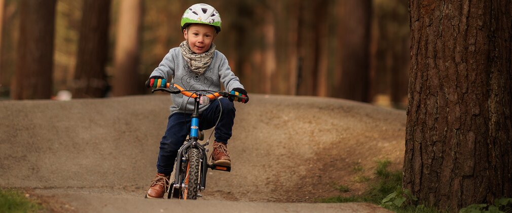 boy rides pump track