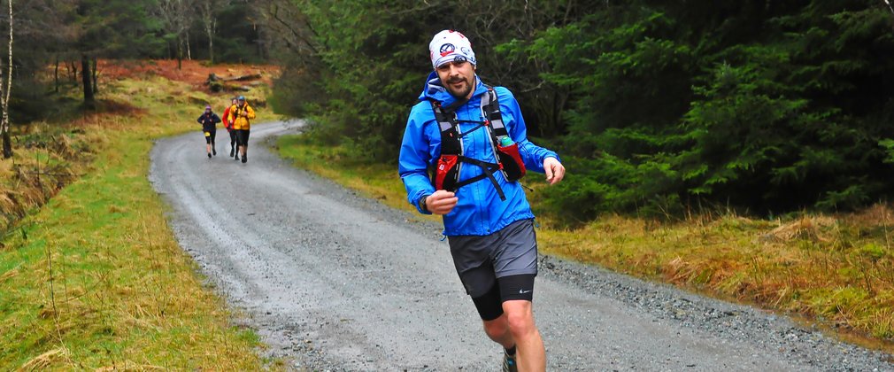 Runners on a woodland trail