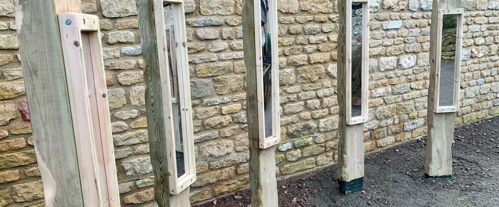 Five freestanding mirrors in a sensory play area