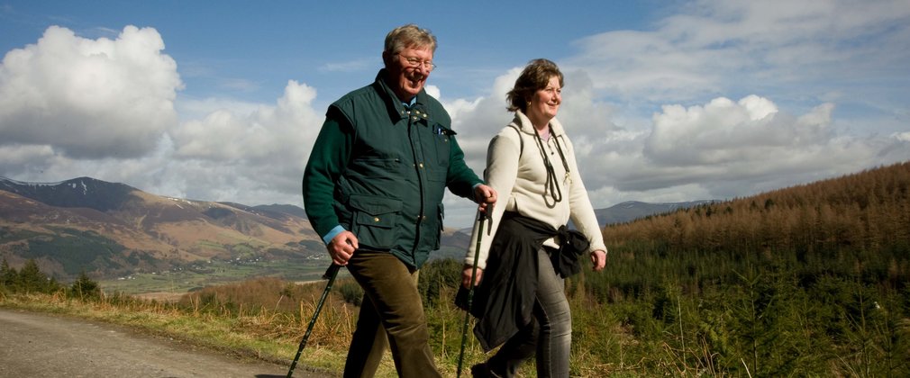 Family walking on a woodland trail