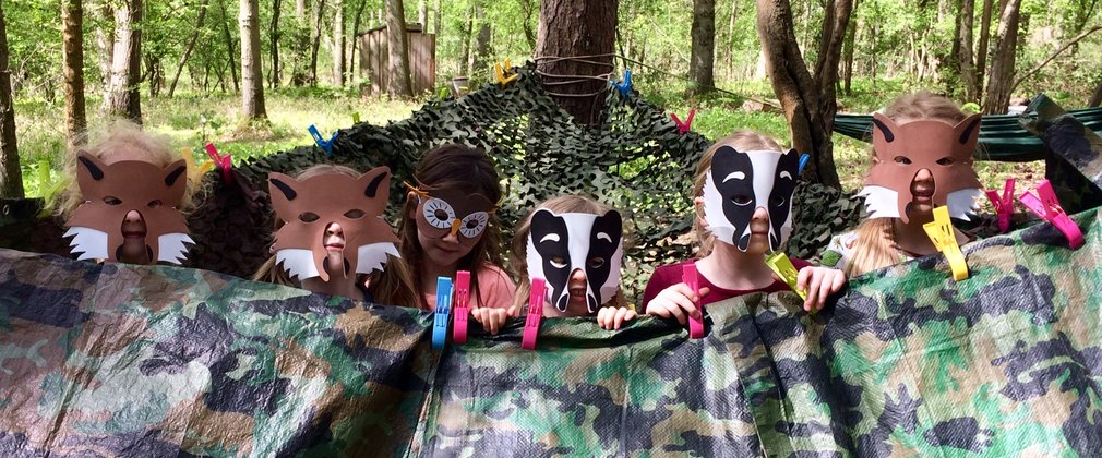 Children with wildlife masks