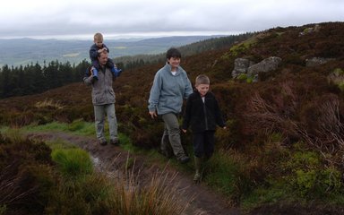 Family walking at Simonside, near Rothbury