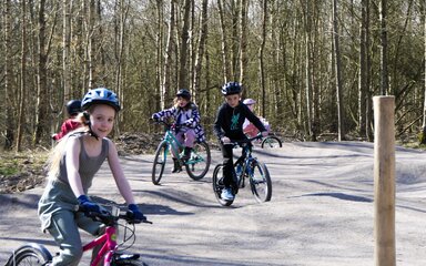 Children riding bikes on Pedal and Play Mountain bike trail