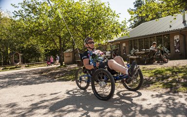 Man using a disability recumbent bike