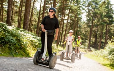 Woman on Segway in the forest