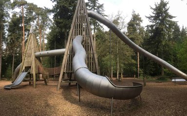 Large slide and childrens play area in the woods 