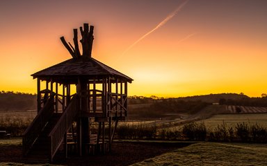 The treehouse play area at sunset