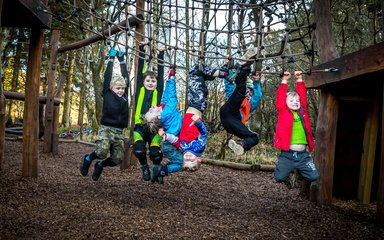 children enjoying forest play area