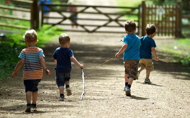 Children running and enjoying the forest 