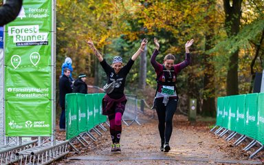 2 happy women ending a running race