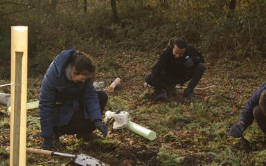 Group members prepare the ground ready for planting