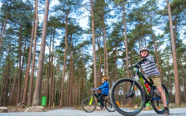 Two children ready to race on the Pedal and Play bike trail