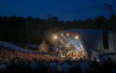 Paul Weller performing on stage at Cannock Chase