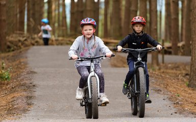 Two young people cycling