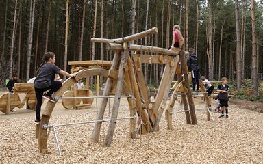 Children on a bike shaped climbing frame