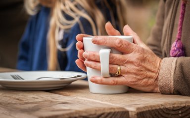 Holding coffee 