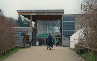 A member walking towards Dalby Forest Visitor Centre