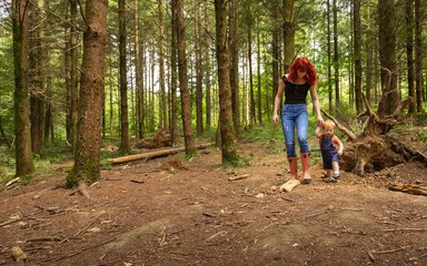 Young family walking and den building