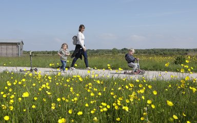 Mum and young children walking at Hicks Lodge